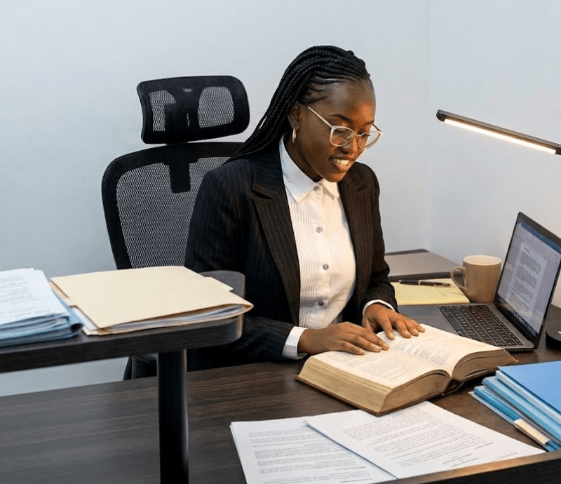 Photo of WS Law Founder seated at a desk